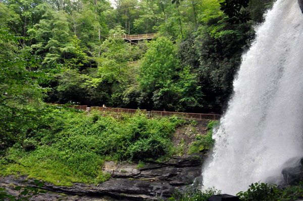 people on the two tiers of path and stairs leading to the falls.